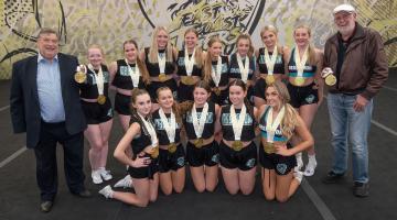 Cllr Eric Broadbent, left, and Cllr Tony Randerson, right, with the World Champion cheerleaders from the East Coast Tigers team.