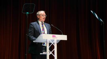 North Yorkshire Council’s deputy leader, Cllr Gareth Dadd, is pictured delivering his opening speech to the Local Government Association’s conference in Harrogate. (Picture credit: LGA/Joe Outterside.)