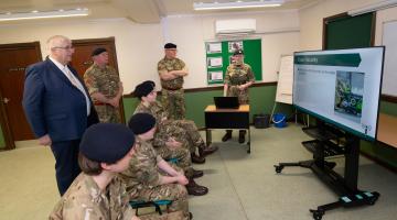 Cllr Ireton watches training presentation with cadets