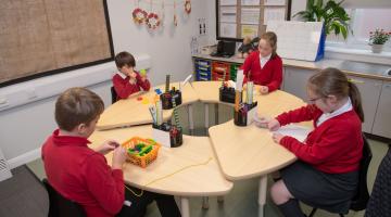 Four children around a table