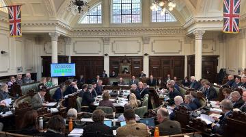 Councillors inside the council chamber at a full council meeting