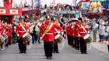Crowds watch as the parade passes along the front at Scarborough on a previous Armed Forces Day. Picture credit: John Westgarth.   