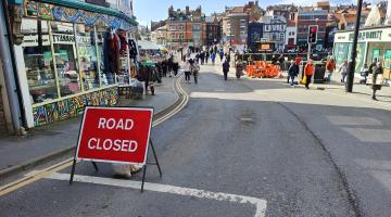 A road closed sign next to Whitby Swing Bridge
