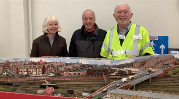 •	A couple from Switzerland who flew in to see the Last Train to Whitby exhibition, with show manager Chris Martin. 