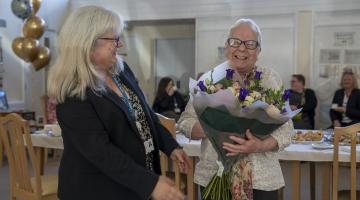 Dot holding flowers with Rachel Bowes