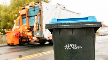 A bin in front of a bin lorry