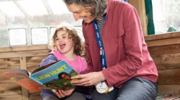 A lady and child reading
