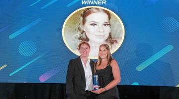 Lily receiving her award