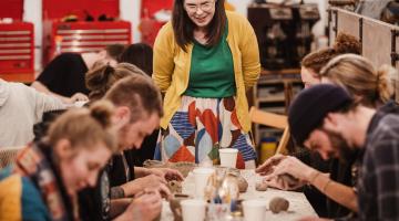 Artist Rebecca Norris hosts a pottery workshop. 