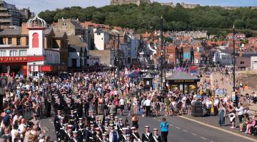 Crowds of people watching parades at Armed Forces Day