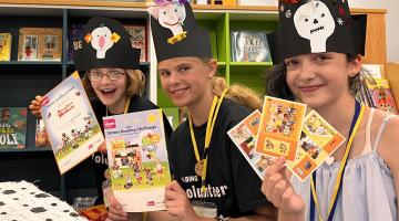 Three young people with books