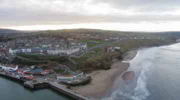 An aerial shot of Whitby’s coastline. A consultation is under way on the future of the cliff lift replacement bus service. 