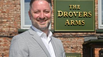 A man outside The Drovers Arms
