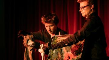 Two people with puppets