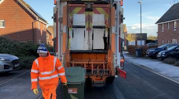 A man collecting the garden waste