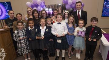 A group of children with awards