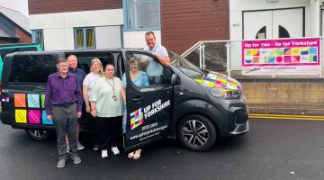 Six people with an electric van