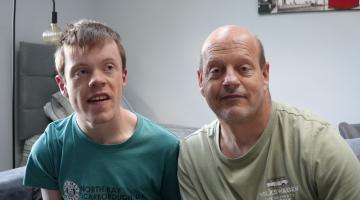 Two men together looking at the camera