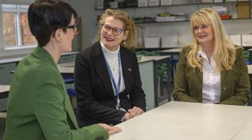 Emma Lambden, El Mayhew and Councillor Annabel Wilkinson discuss low education funding.. 