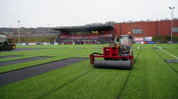 A tractor removing the pitch at Scarborough Sports Village