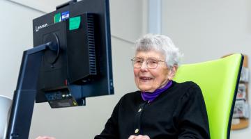 Veronica sat at a computer