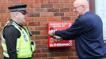 PC Paul Mushens, of North Yorkshire Police, is shown the Daniel Baird Foundation #controlthebleed kit by North Yorkshire Council’s community safety officer, Philip Wright, in the Market Place, Thirsk