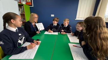 Children sat around a table at St Martins School