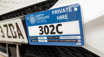 A taxi license plate