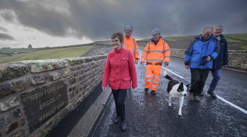 From left, Cllr Yvonne Peacock, head of bridges, Phil Richardson, Cllr Malcolm Taylor, with residents Anthony Hird and Ron Woolford, walking along the new bridge. 