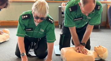 Amanda and Adrian Whitwood demonstrate first aid on a dummy.