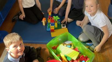 School children in a circle playing