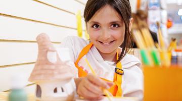 A young girl doing crafts