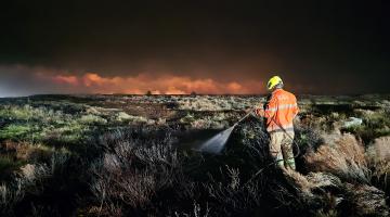 A firefighter with the moors fire - Credit Paul Edwards