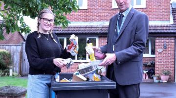  resident Alexis Flint shows how to recycle waste correctly with North Yorkshire Council’s executive member for managing our environment, Cllr Richard Foster.