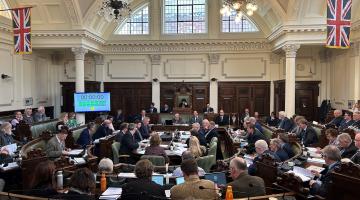 Councillors inside the council chamber at a full council meeting