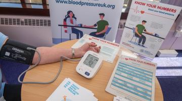 Someone taking a blood pressure reading