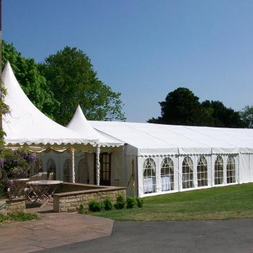 Large wedding marquee outside the venue.