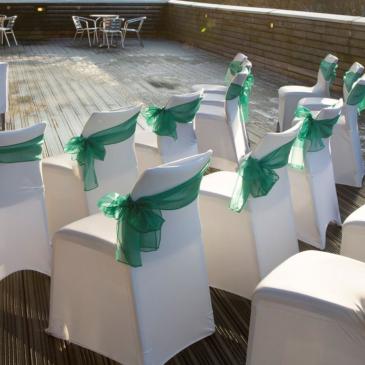 Chairs set out ready for wedding guests to be seated.