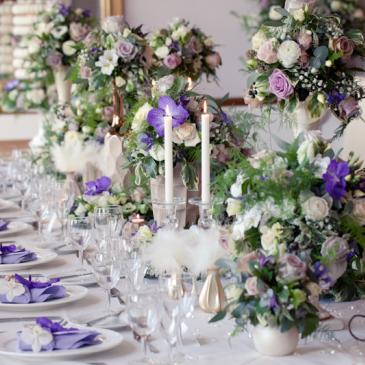 Dining table laid out for wedding meal