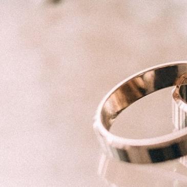 Pair of wedding bands on table.