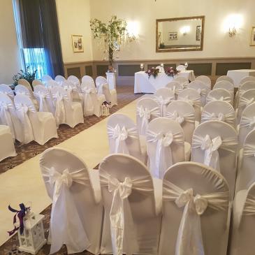Seats facing towards wedding ceremony at The Crown Hotel