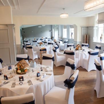 Tables set with decorations for main wedding dinner 