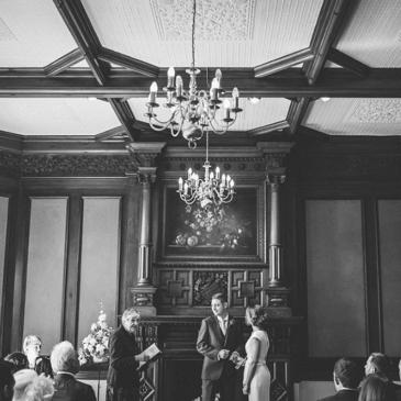 Bride and groom standing in front of wedding guests. 