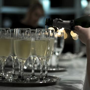 Alcohol being poured into glasses.