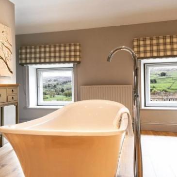A bathroom with the view of the countryside at The Burgoyne Hotel.