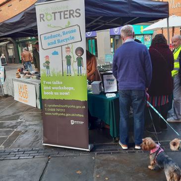 Rotters at a stall with members of the public