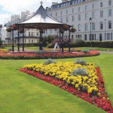 Flower beds and bandstand in the garden