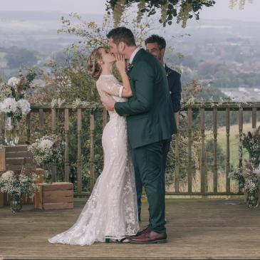 Wedding couple embracing after ceremony