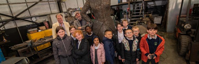 Children looking at the Sophia sculpture