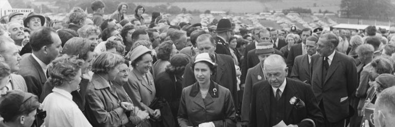 Queen Elizabeth II is shown around the Great Yorkshire Show by the show's president, Lieutenant Colonel Sir John Dunnington-Jefferson, in 1957.